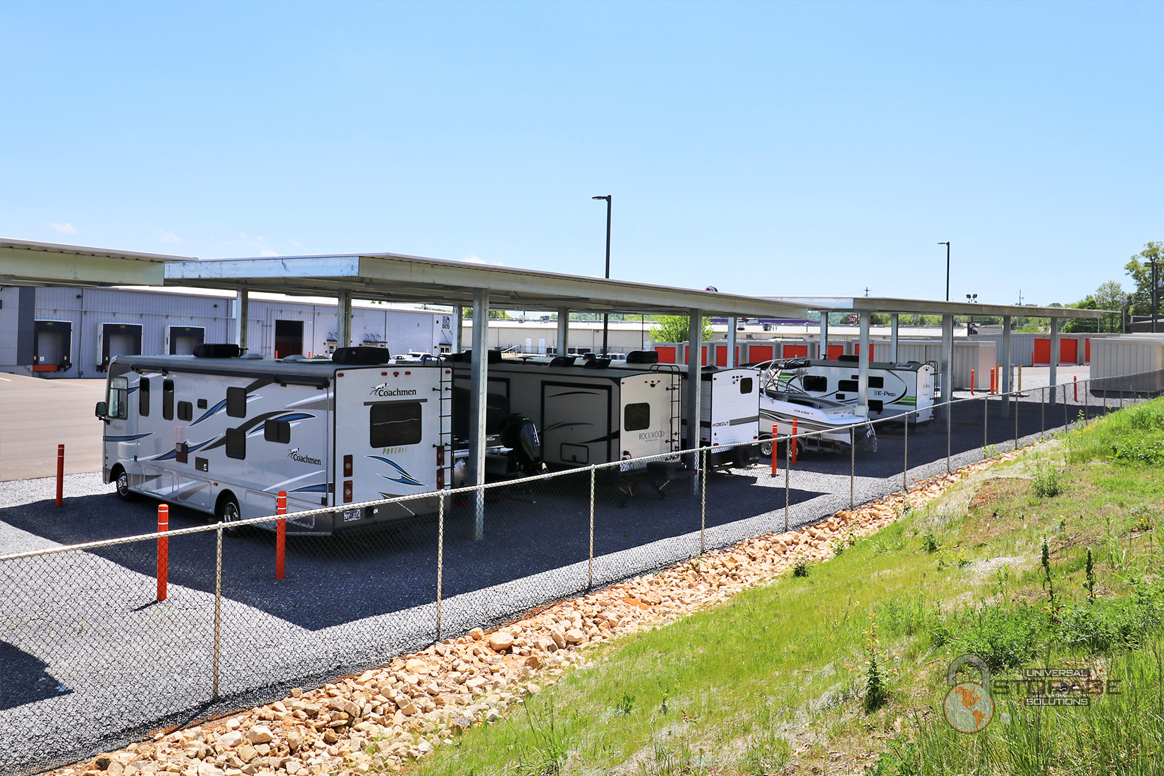 Universal Self Storage Gray Outdoor Covered Parking with RV's and boats.